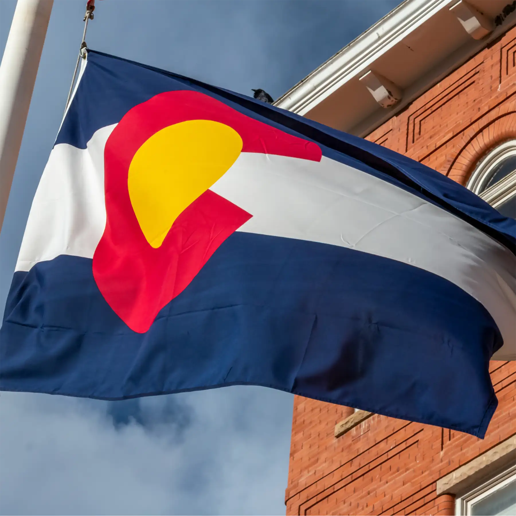 The Colorado State flag waving